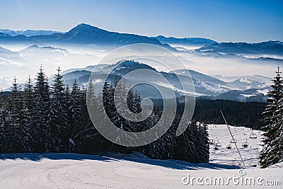 Ski slope with ski cableway on Kubinska Hola ski restort during winter Stock Photo