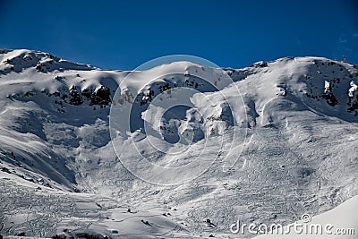 Ski tracks on the off piste terrain at the Meribel Ski Resort in France. Stock Photo