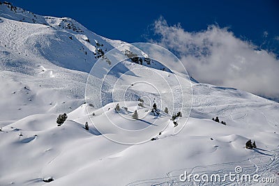 Ski tracks on the off piste terrain at the Meribel Ski Resort in France. Stock Photo