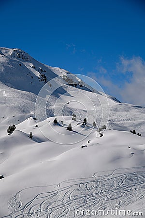 Ski tracks at the off piste terrain at the Meribel Ski Resort in France. Stock Photo