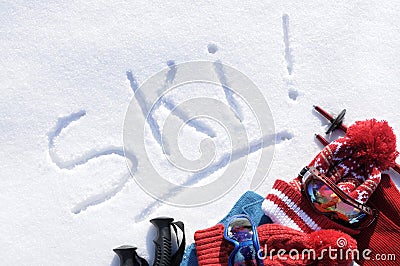 Ski vacation, winter sports, word written in snow with skiing equipment Stock Photo