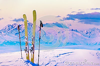 Ski in winter season, mountains and ski touring backcountry equipments on the top of snowy mountains in sunny Stock Photo