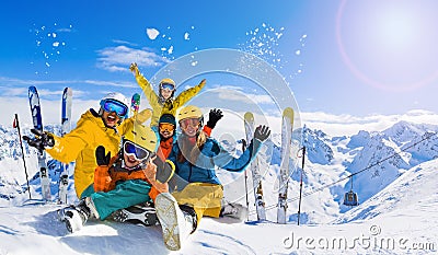 Ski in winter season, mountainsfamily in sunny day in France, Alps above the clouds Stock Photo