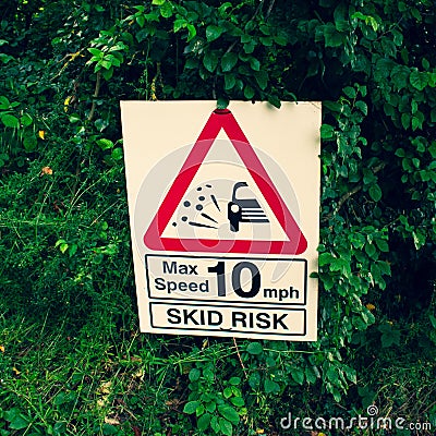 Skid risk warning sign on a country road Stock Photo