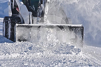 Skid steer blowing snow Editorial Stock Photo