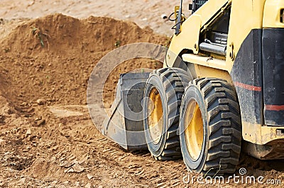 Skid steer loader works Stock Photo