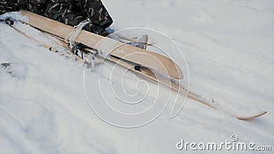 Skier after accident waiting for rescue lying in snow. Clip. Professional skier after crash accident on skiing resort Stock Photo