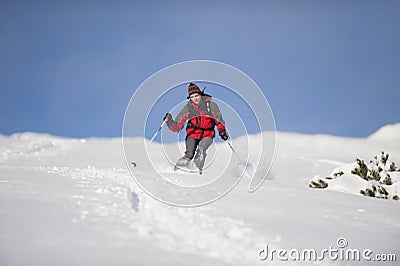 Skier in action skiing Stock Photo