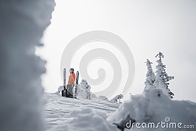 Skier in the backcountry of a snowy mountain landscape near Rossland Range, Canada Editorial Stock Photo