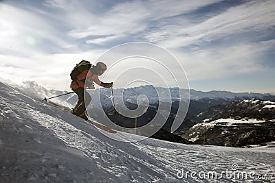 Skier freerides at the backlit resort, Tetnuldi, the Greater Caucasus Mountain Range, Upper Svaneti, Georgia, Europe Editorial Stock Photo