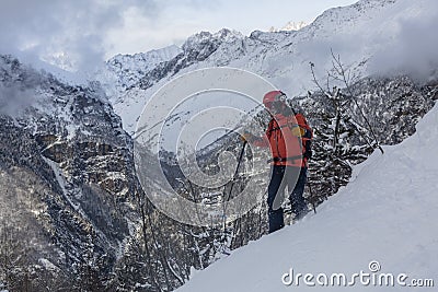 Skier freerides at the backlit resort, Tetnuldi, the Greater Caucasus Mountain Range, Upper Svaneti, Georgia, Europe Editorial Stock Photo