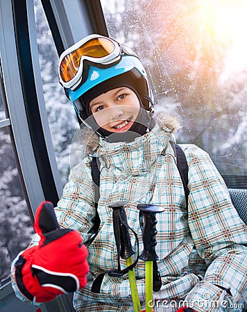 Skier girl on ski lift Stock Photo