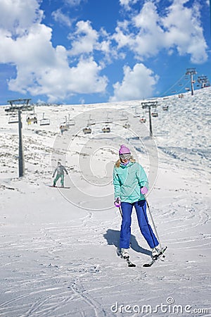 Skier girl on a ski resort Stock Photo