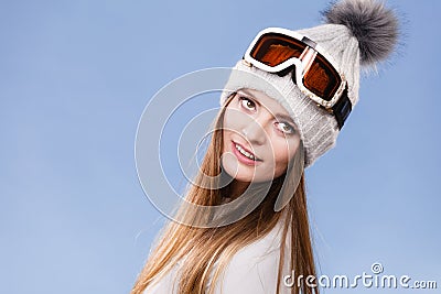 Skier girl wearing warm clothes ski googles portrait. Stock Photo