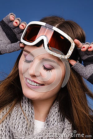 Skier girl wearing warm clothes ski googles portrait. Stock Photo