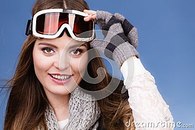 Skier girl wearing warm clothes ski googles portrait. Stock Photo