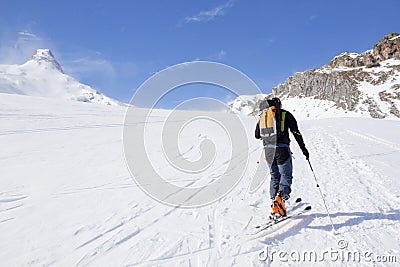 Skier going up of a mountain Stock Photo