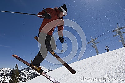 Skier Jumping In Midair Stock Photo