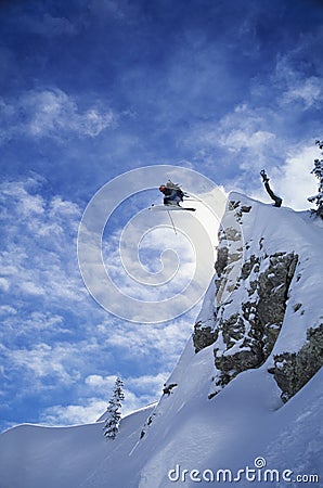 Skier Jumping From Mountain Stock Photo