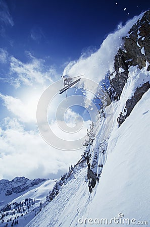 Skier Jumping From Mountain Stock Photo