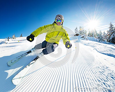 Skier on piste in high mountains Stock Photo