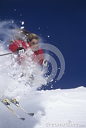 Skier Through Powdery Snow On Slope Stock Photo