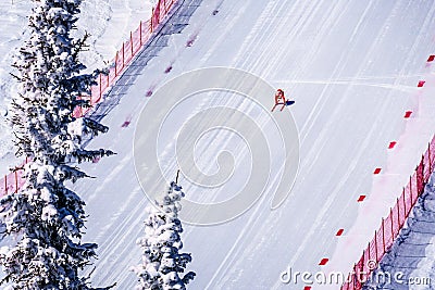 Skier racing down the Steep Speed skiing slope at Velocity Challenge and FIS Speed Ski World Cup Race at Sun Peaks Ski Resort Editorial Stock Photo