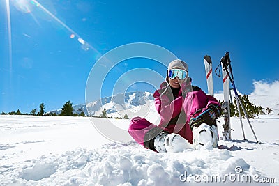 Skier resting on the ski slope Stock Photo
