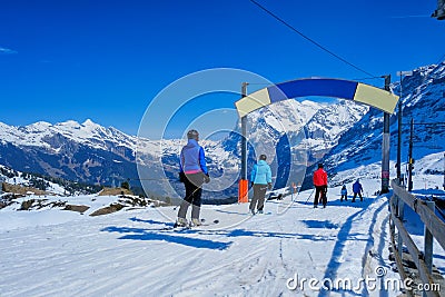 Skier skiing downhill in high mountains Kleine Scheidegg station at Switzerland Editorial Stock Photo