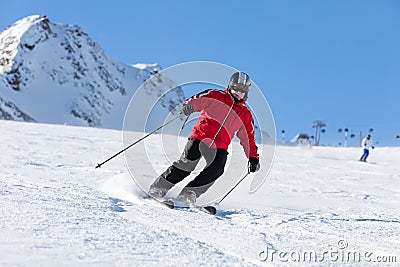 Skier skiing on ski slope Stock Photo