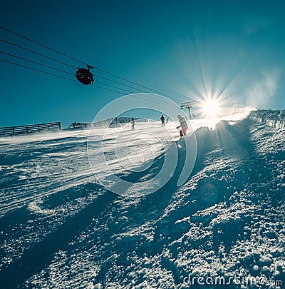 Skier slides down on the snow slope Stock Photo