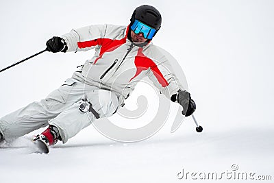 Skier on slope in mountains Stock Photo