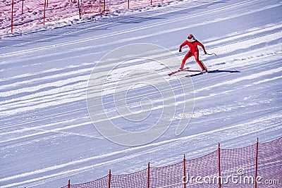 Skier trying to slow down at the bottom of the steep slope at Velocity Challenge and FIS Speed Ski World Cup Race at Sun Peaks Editorial Stock Photo