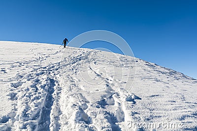 Skier walks up to the top. Editorial Stock Photo