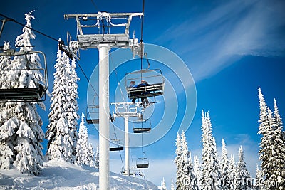 Skiers on the Attridge Chair at Silver Star Mountain Editorial Stock Photo