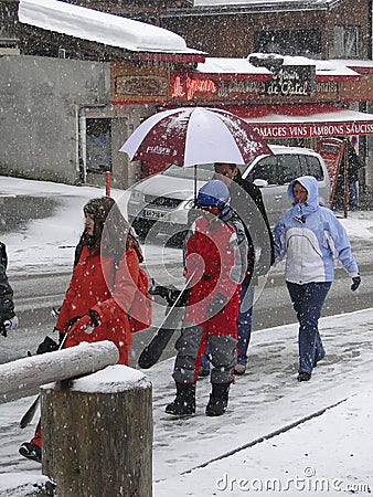 Skiers come back to town in a snowstorm Editorial Stock Photo