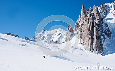 Skiers in front of the breathtaking view of Mont Blanc de Tacul Stock Photo