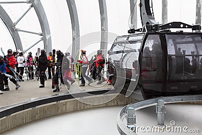 Skiers out of cabin of cable car Editorial Stock Photo
