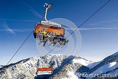 Skiers sitting onski lift chair in ski resort Jasna, Slovakia Editorial Stock Photo