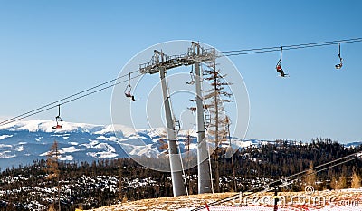 Skiers sitting at ski-lift chairs in resort Tatranska Lomnica, Slovakia Editorial Stock Photo