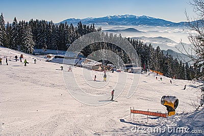 Skiers on ski slope on Kubinska Hola ski restort during winter Editorial Stock Photo