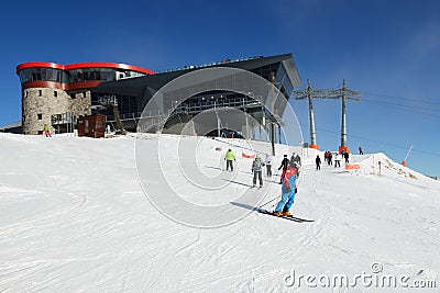 The skiers are on slope near cableway station on Chopok in Jasna Low Tatras, Slovakia Editorial Stock Photo