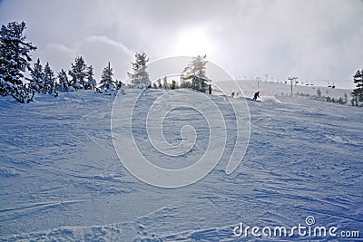 Skiers on the slope at winter resort Stock Photo