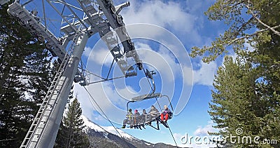 Skiers and snowboarders on a ski lift, cinematic shot Editorial Stock Photo