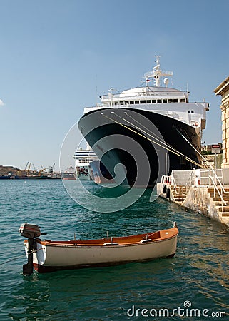 Skiff and Steamship Stock Photo