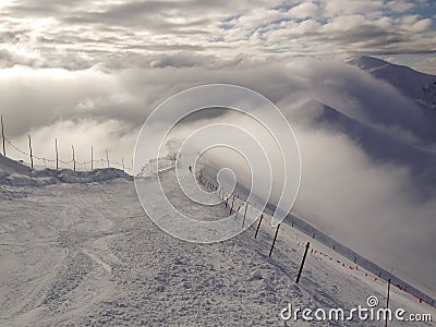 Skiing in the clouds Stock Photo