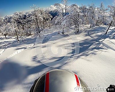 Skiing in fresh snow. POV using action cam on the helmet Stock Photo