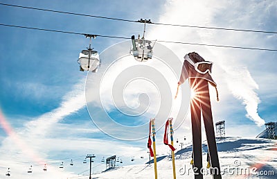 Skiing goggles and skis poles at resort glacier with chair lift Stock Photo