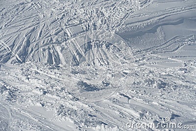 Skiing slope in winter showing traces of skiing in an irregular pattern Stock Photo