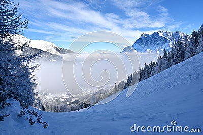 Skiing above the clouds Stock Photo